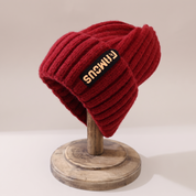 A burgundy women's knitted hat