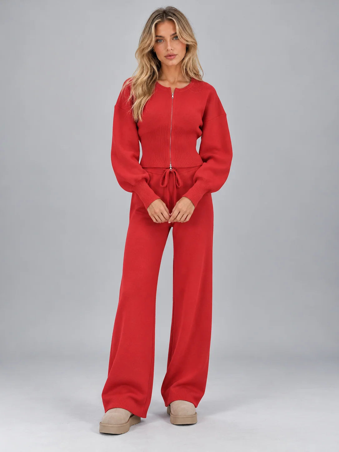 Women's knitted co-ord set with zip cardigan and wide leg trousers in red