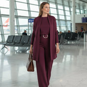 Women's knitted three-piece set with long cardigan and trousers in burgundy