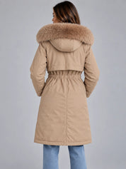 Women's long hooded winter coat with faux fur trim and drawstring