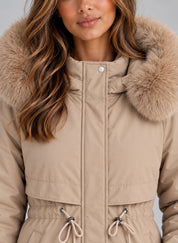 Women's long hooded winter coat with faux fur trim and drawstring