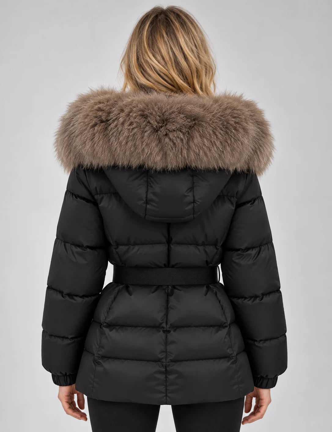 Women's puffer jacket in black with faux fur collar and belt