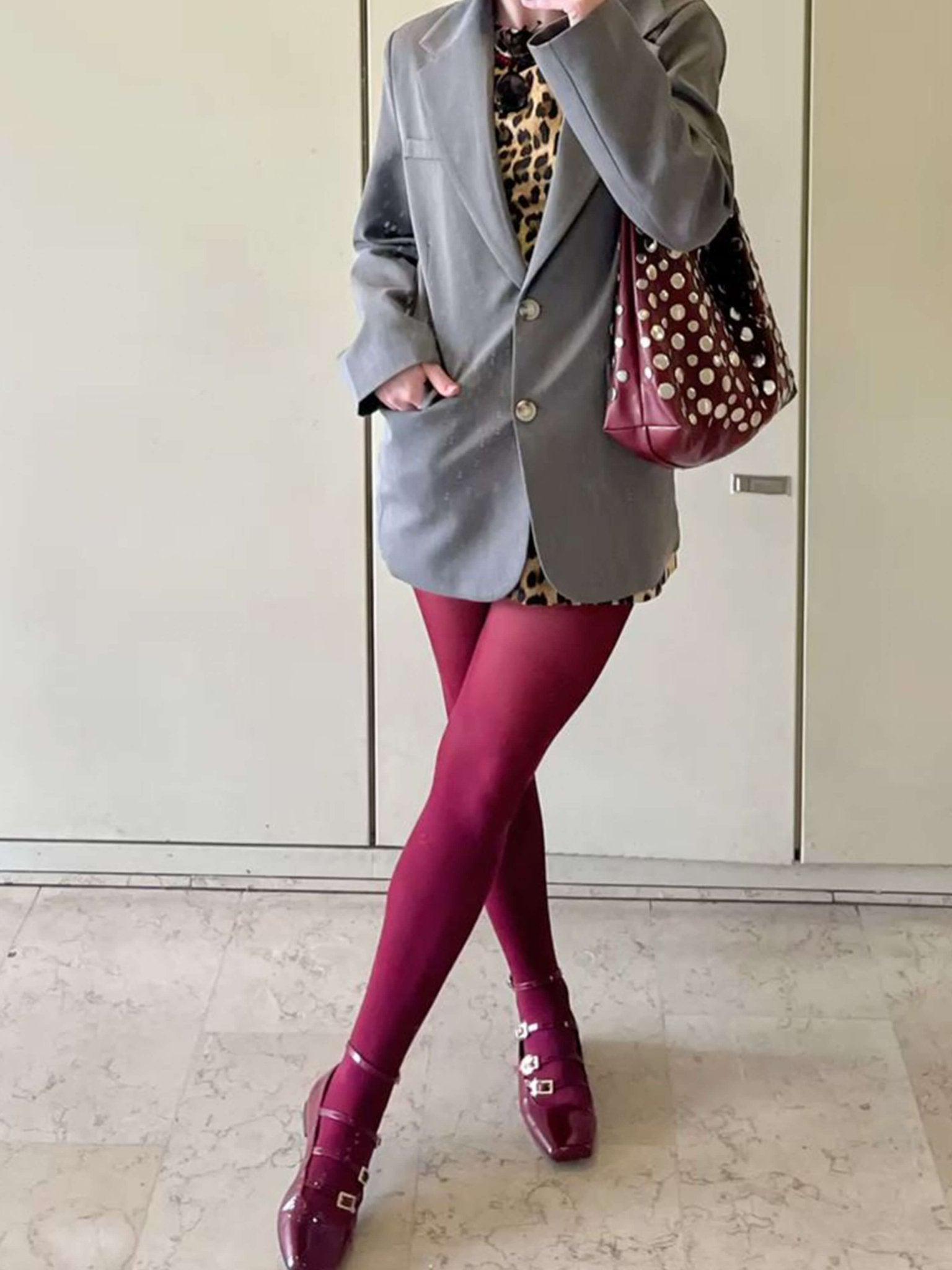 Women's studded faux leather bucket bag with drawstring