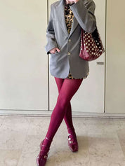 Women's studded faux leather bucket bag with drawstring