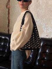 Women's studded faux leather bucket bag with drawstring