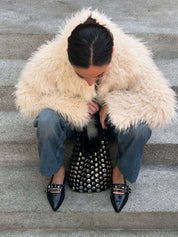 Women's studded faux leather bucket bag with drawstring