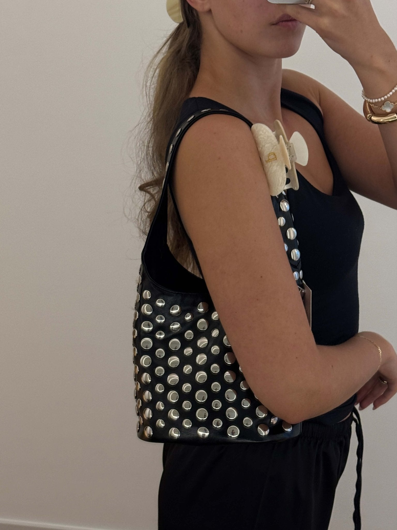 Women's studded faux leather bucket bag with drawstring