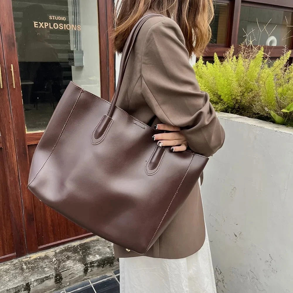 Women's large faux leather tote bag with zip and buckle