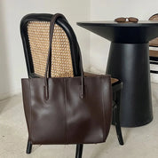 Women's large faux leather tote bag with zip and buckle