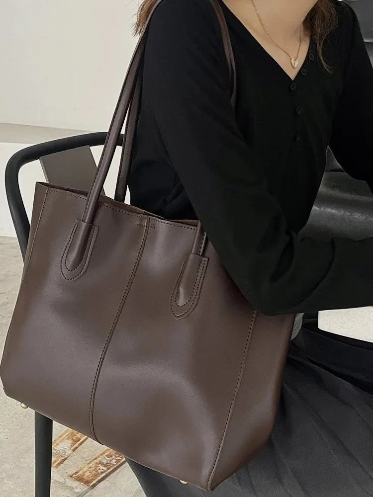 Women's large faux leather tote bag with zip and buckle