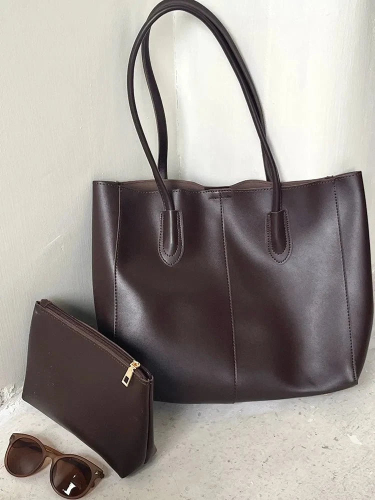 Women's large faux leather tote bag with zip and buckle