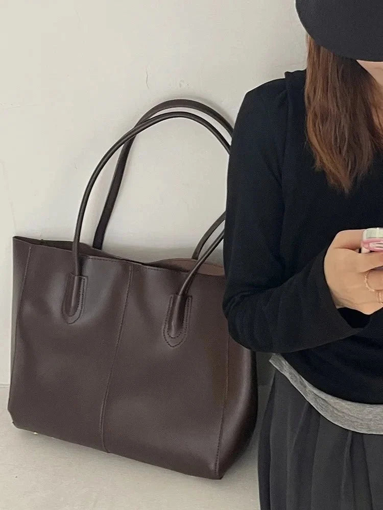 Women's large faux leather tote bag with zip and buckle