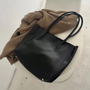 Women's large faux leather tote bag with zip and buckle