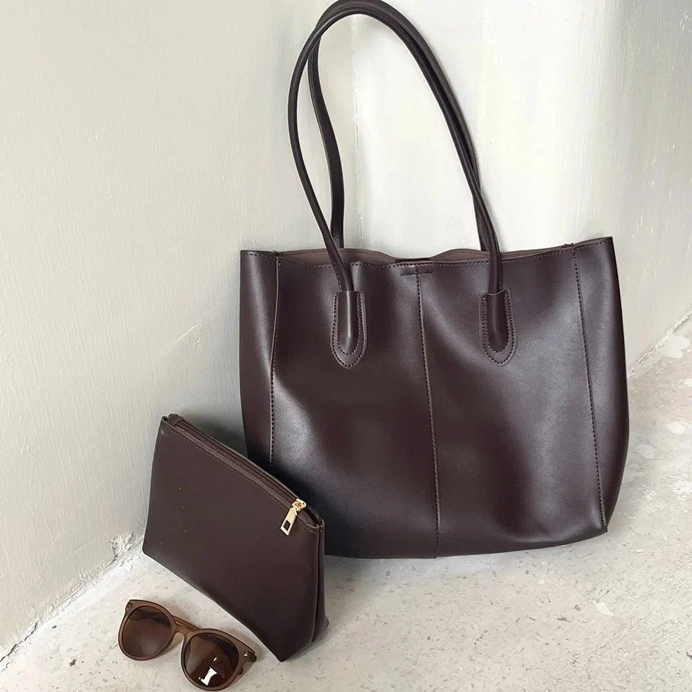 Women's large faux leather tote bag with zip and buckle