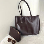 Women's large faux leather tote bag with zip and buckle
