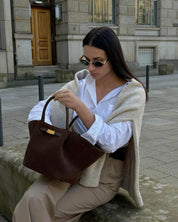 Women's faux suede handbag with gold-tone clasp