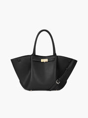 Women's faux leather handbag with adjustable shoulder strap