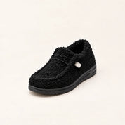 Women's teddy slippers with closed toe and sturdy sole in black