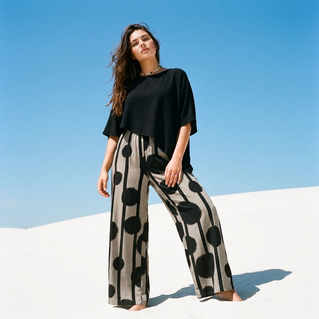 Women's two-piece set with black top and printed wide leg trousers