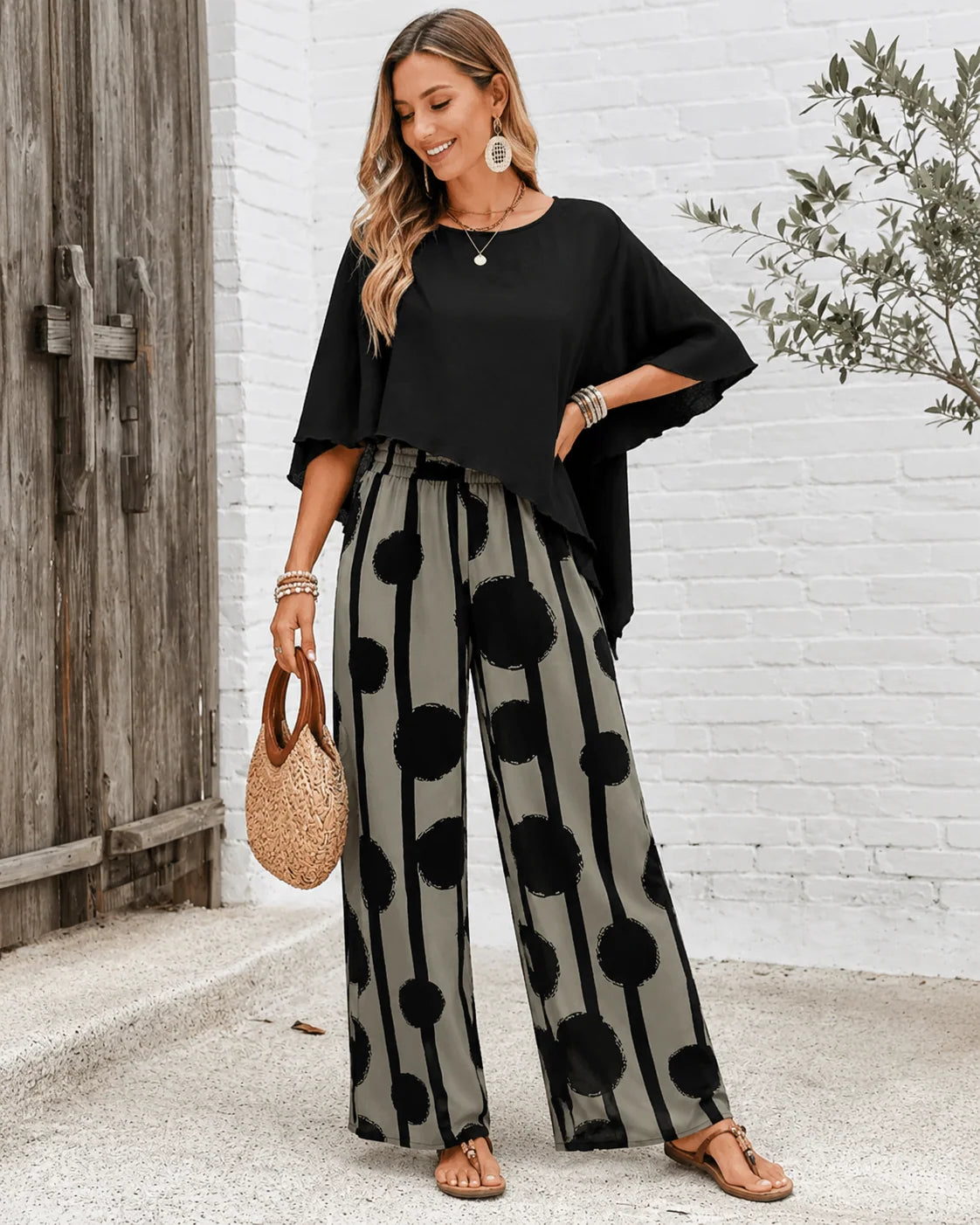 Women's two-piece set with black top and printed wide leg trousers
