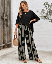Women's two-piece set with black top and printed wide leg trousers