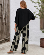 Women's two-piece set with black top and printed wide leg trousers
