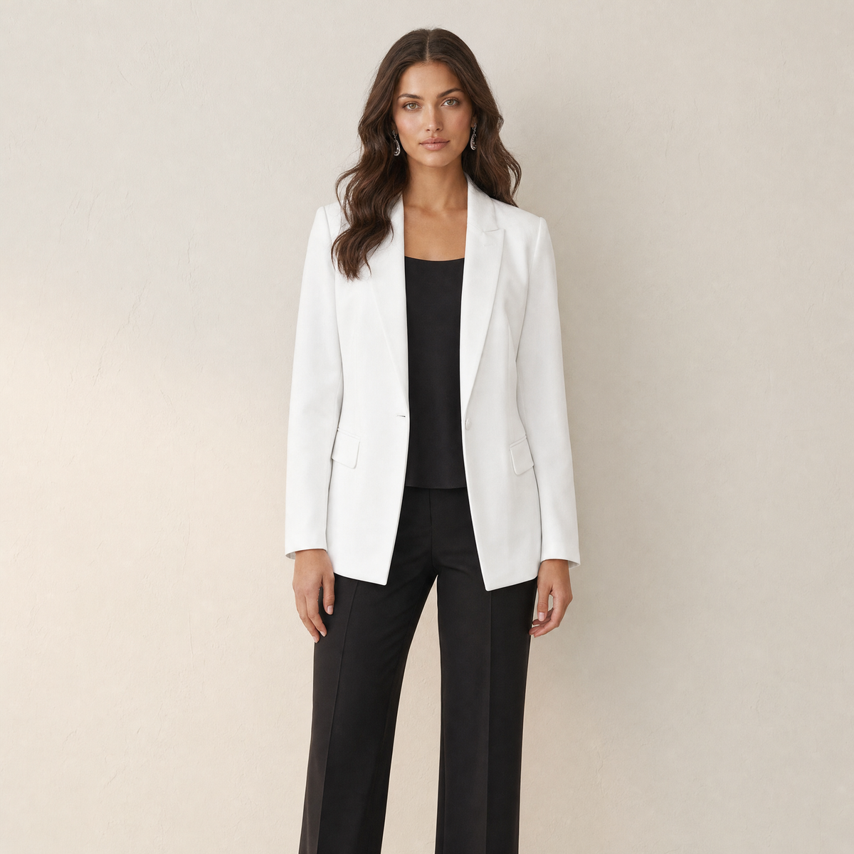 A model wearing a slim-fit white women's blazer, front view