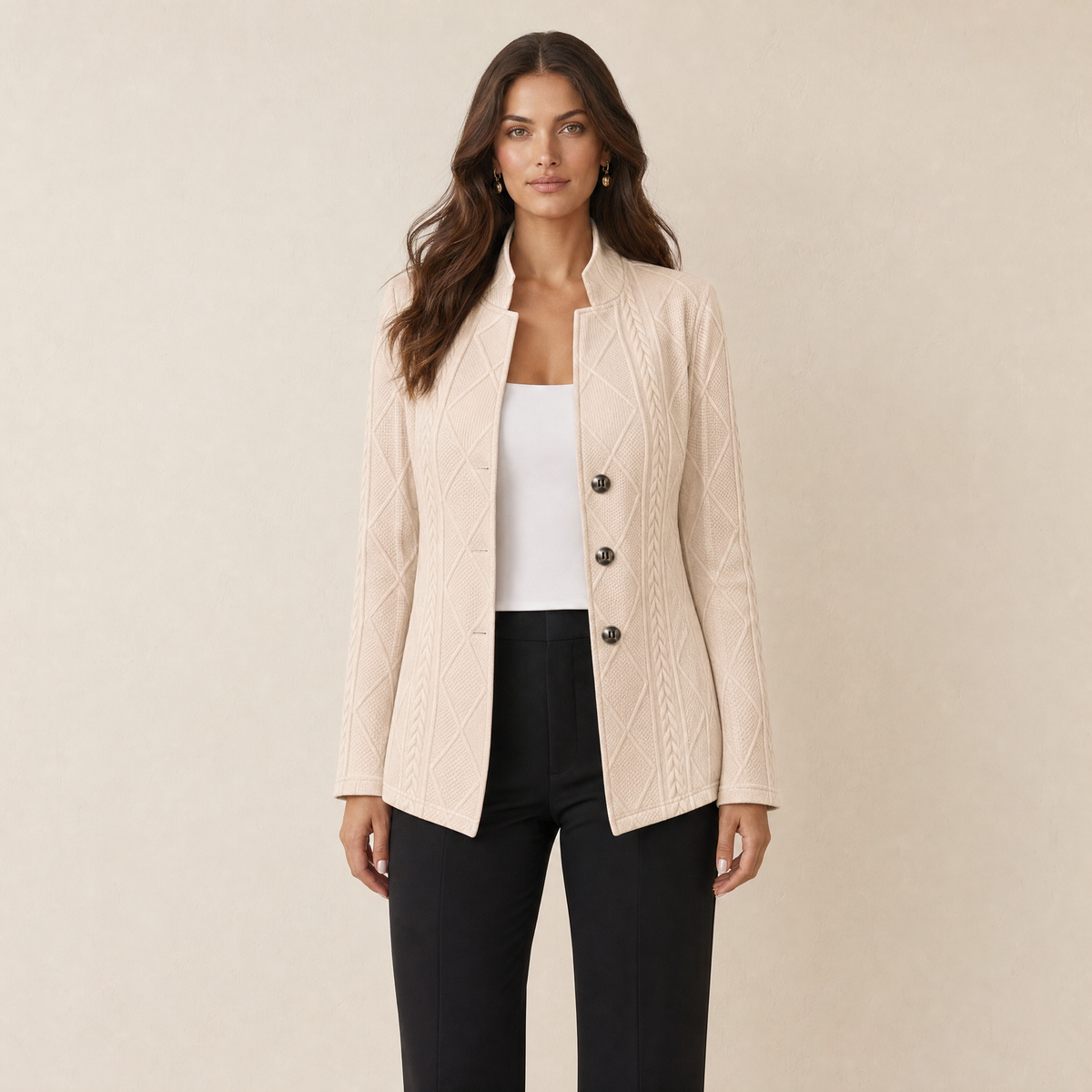 A model wearing a textured beige women's blazer with a stand collar, front view