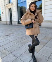 Women's belted puffer jacket with high collar, photo 1